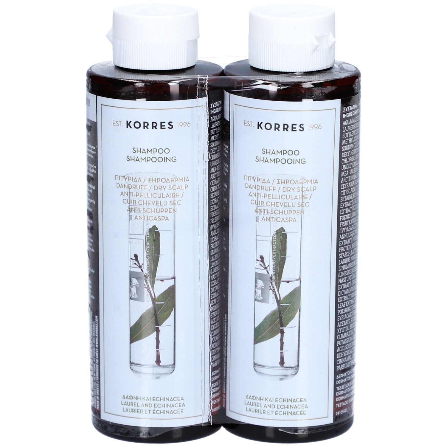 Deux flacons de shampooing marron avec bouchons blancs. Étiquettes avec informations produit et une branche.