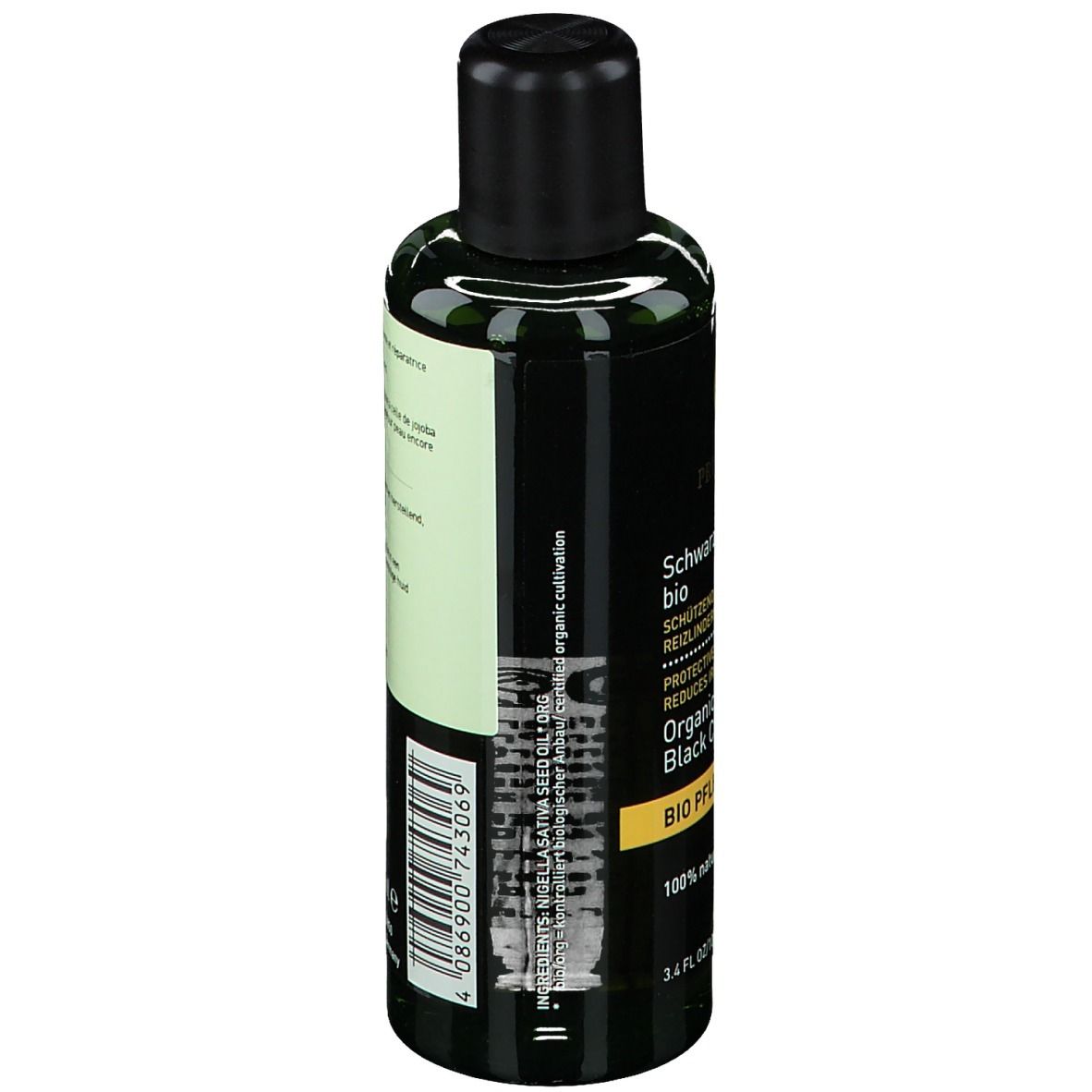 Flacon vert avec bouchon noir. Étiquette avec texte: Schwarzkümmelöl bio.