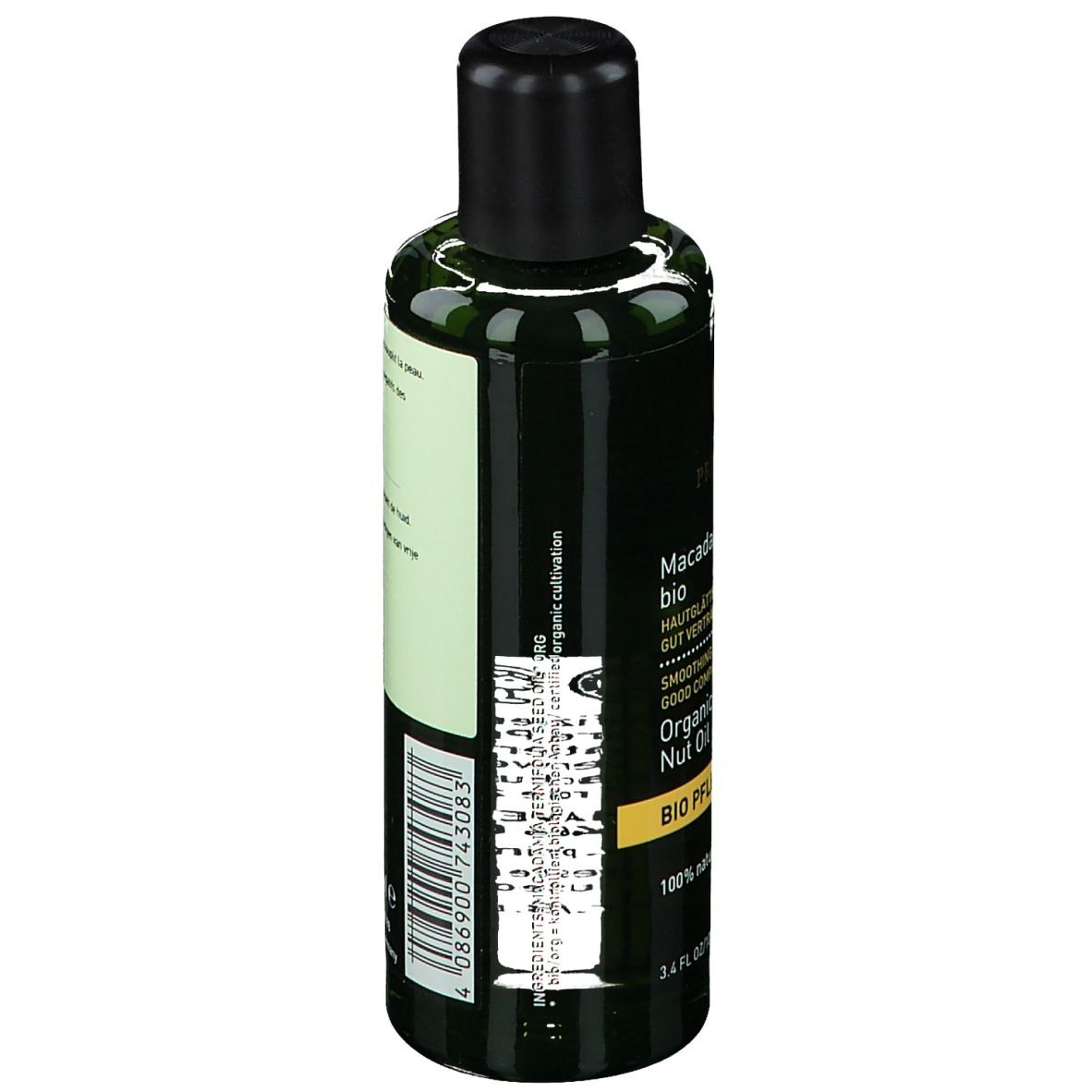 Dos du flacon vert. Étiquette avec informations produit, ingrédients et fabricant. Bouchon noir.