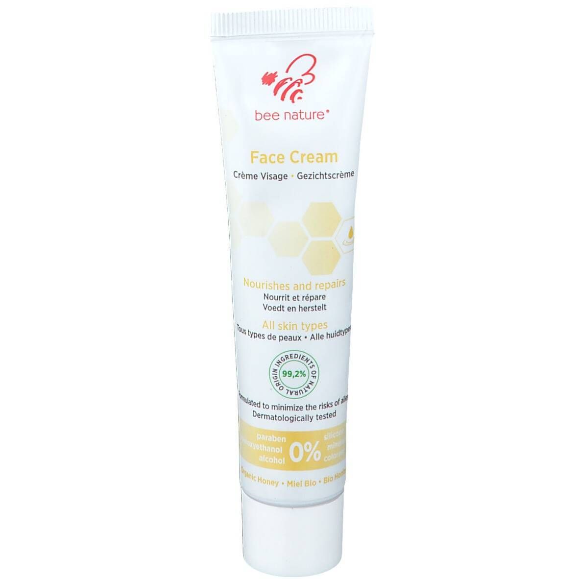 Tube de crème visage blanc avec nom et logo du produit. Contient du texte en allemand, anglais, français et néerlandais. Testé dermatologiquement.