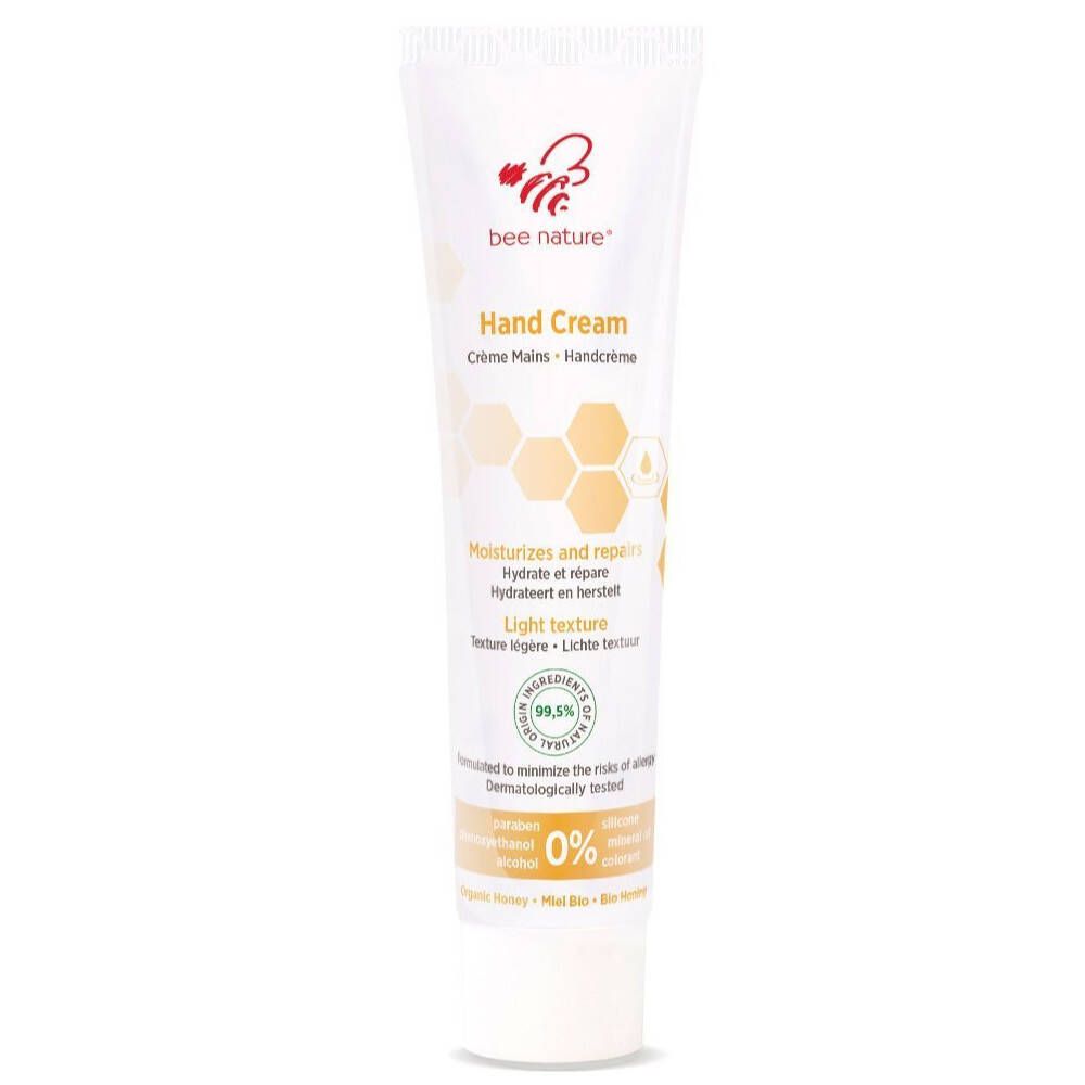 Tube de crème pour les mains blanche. Inscription: bee nature®, Hand Cream. Motif en nid d'abeille. Contient 99,5 % d'ingrédients naturels.