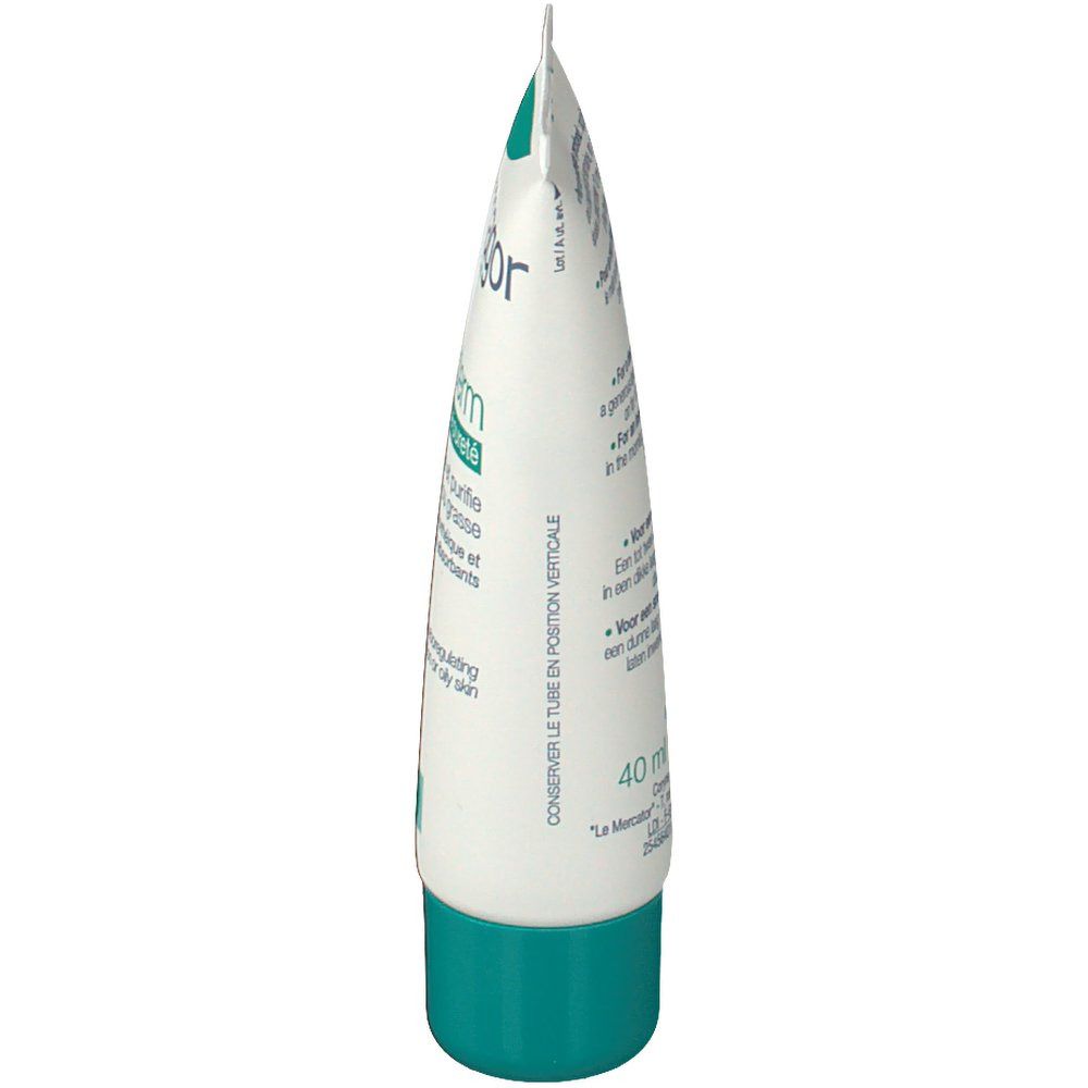 Vue latérale du tube de crème. Couleur blanche et verte. Texte multilingue.