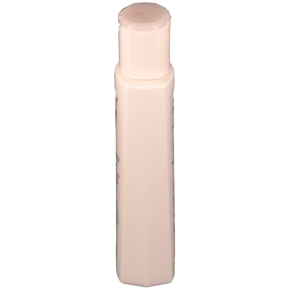 Flacon beige avec bouchon rabattable, vue latérale. Aucun autre détail visible.