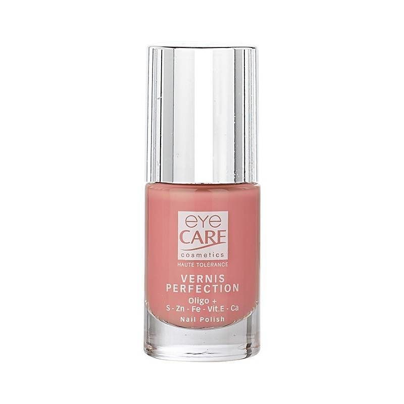 Flacon de vernis à ongles rose. Bouchon argenté avec dessus noir. Inscription : EYE CARE, VERNIS PERFECTION, Oligo + S-Zn-Fe-Vit.E-Ca Nail Polish.