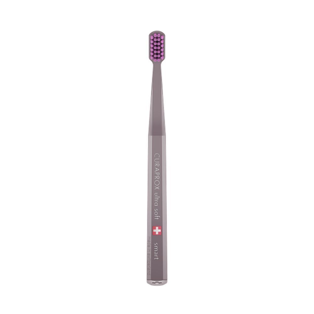 Brosse à dents grise avec poils violets. Inscription: CURAPROX ultra soft smart. Croix suisse.