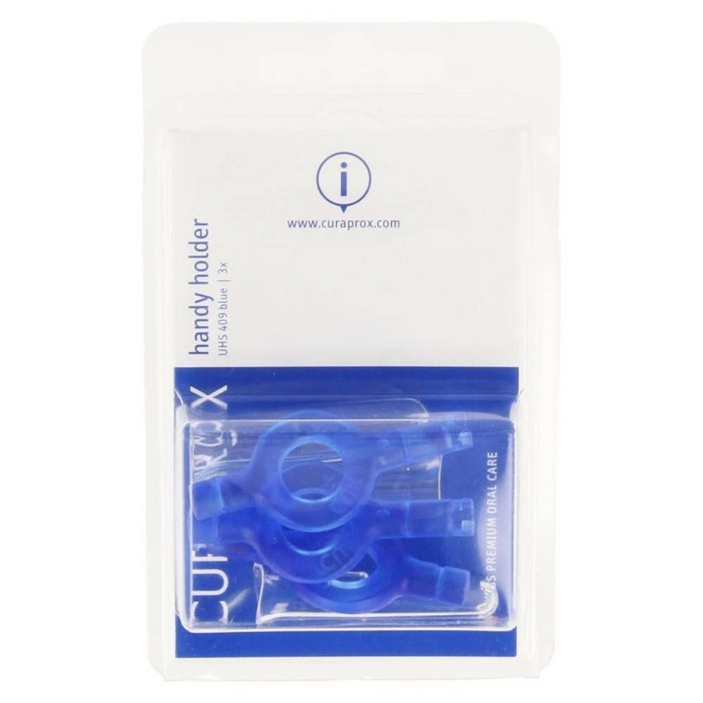 Emballage blister avec porte-brosses interdentaires Curaprox bleus. Visible: 3 supports, nom du produit, marque et site web.