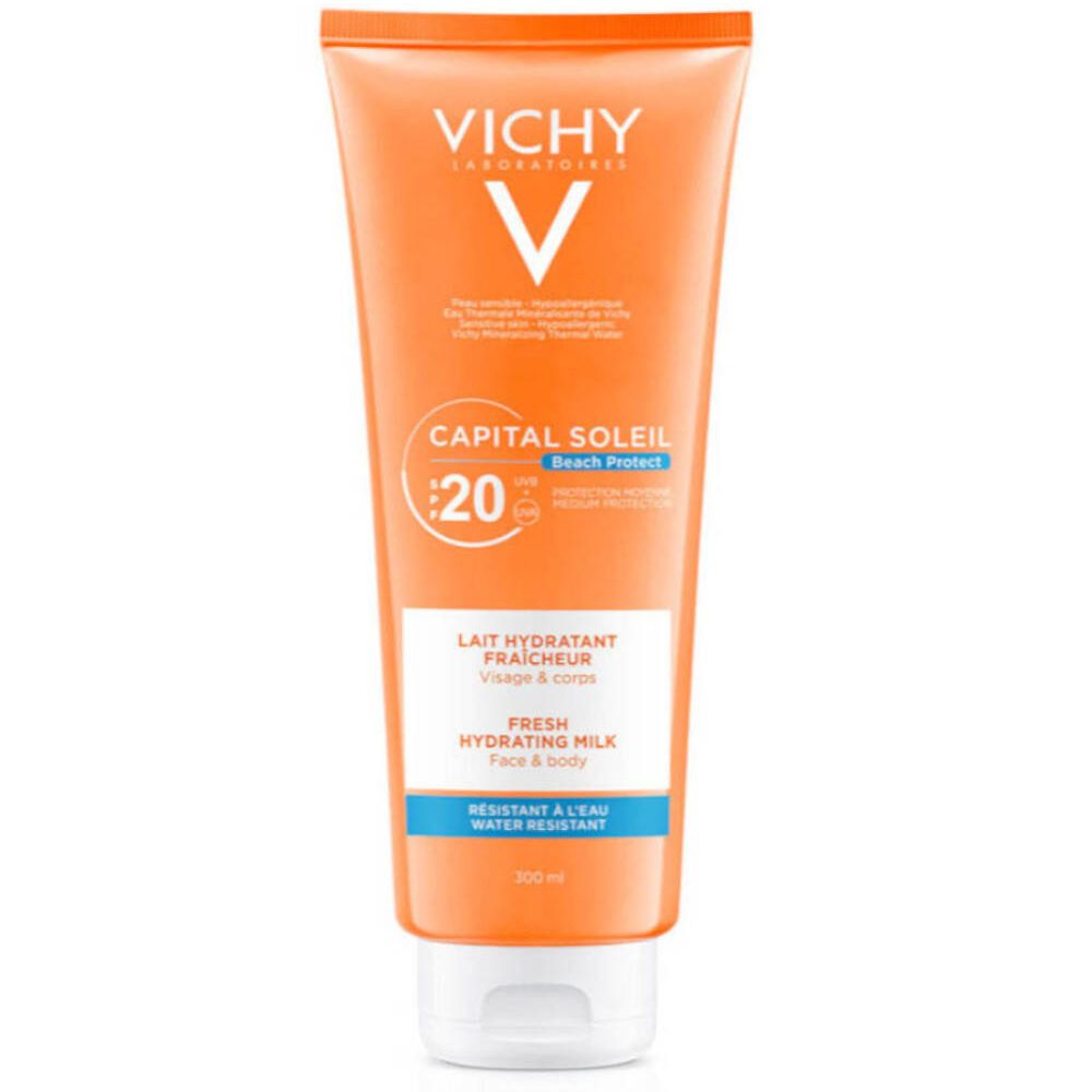 Tube orange avec bouchon blanc. VICHY CAPITAL SOLEIL Lait Hydratant Fraicheur SPF20. Texte: Lait Hydratant Fraicheur, Fresh Hydrating Milk, Visage & corps.