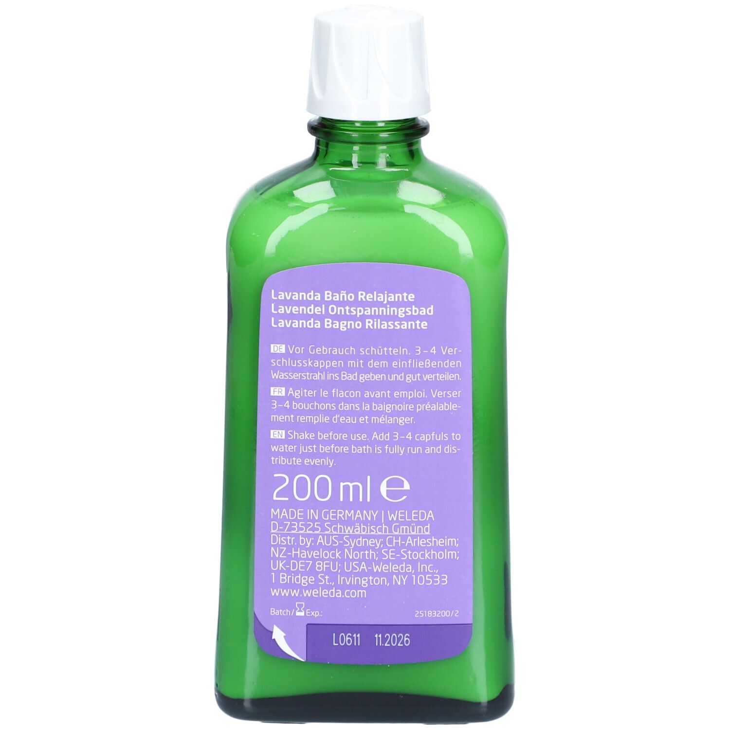 Dos du flacon en verre vert. Étiquette avec informations sur le produit, ingrédients et adresse du fabricant.