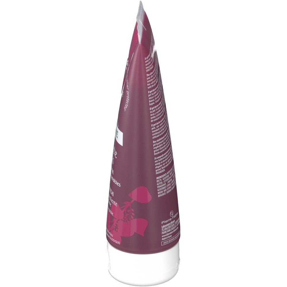 Tube de gel douche bordeaux, bouchon blanc. Texte et logo visibles.