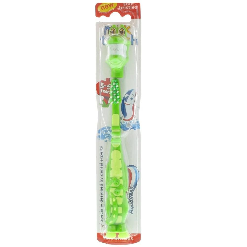 Brosse à dents enfant verte, tête animale. Soie souple, emballage blister. Marque : Aquafresh.