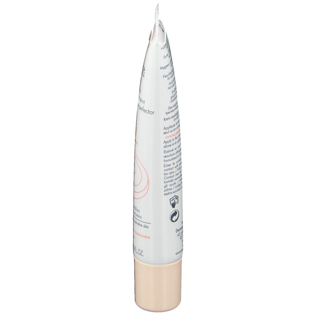 Vue latérale du tube de crème. Texte et logos sur fond blanc. Bouchon beige.
