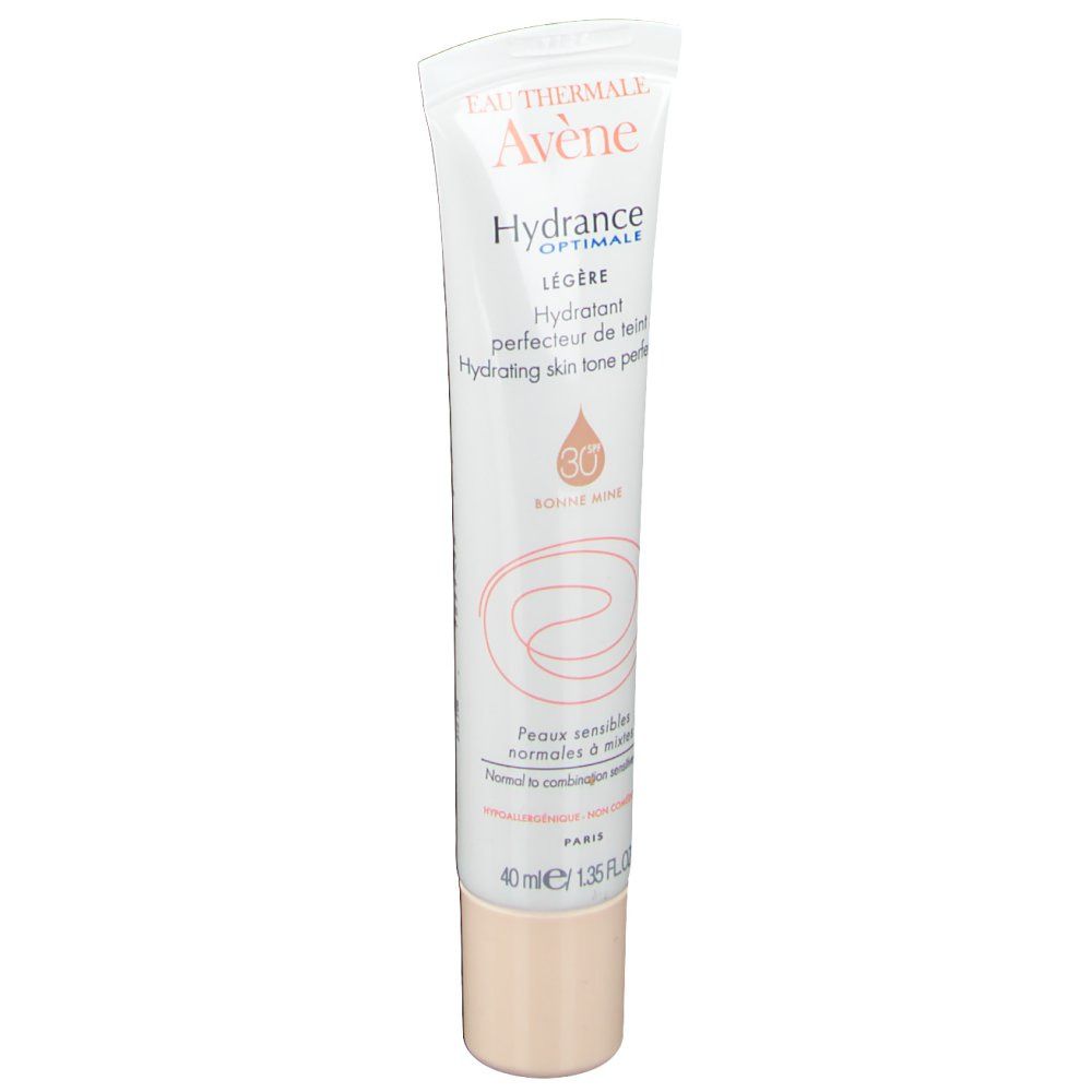 Tube de crème blanche avec impression. Contient des informations sur le produit et le logo de la marque. SPF 30. Bouchon beige. 40 ml.