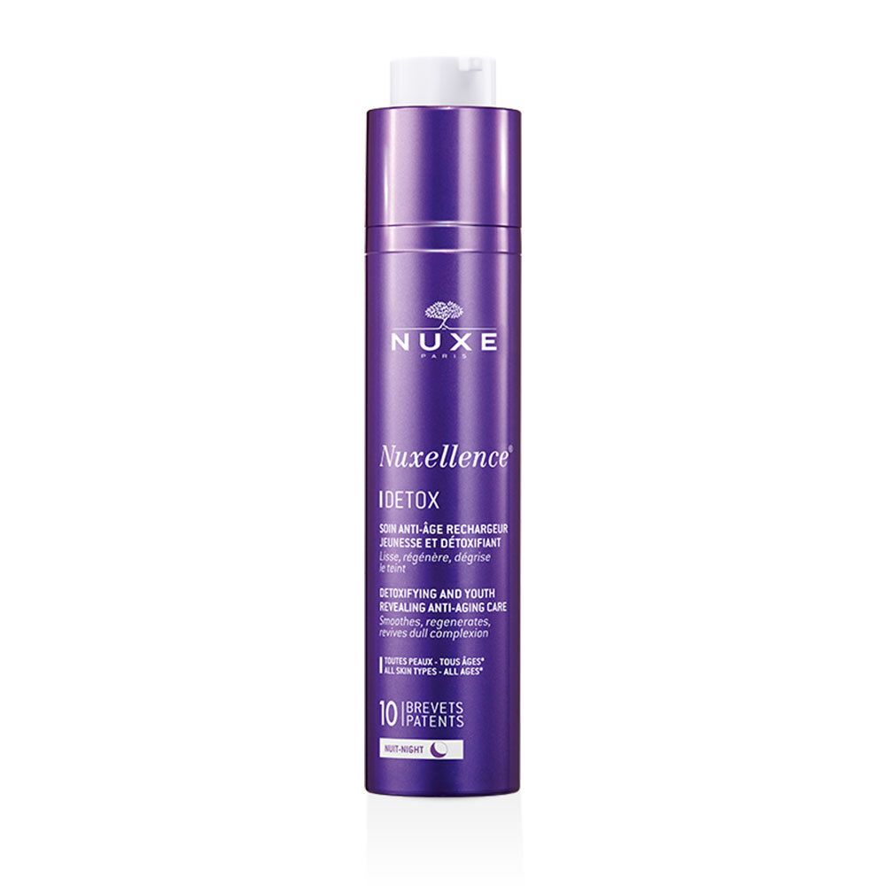 Flacon violet avec bouchon blanc. Inscription NUXE, Nuxellence Detox. 10 brevets. Tous types de peaux.