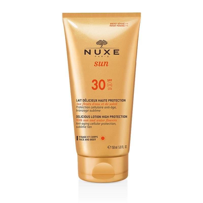 Tube de lait solaire NUXE Sun SPF 30. Tube doré avec informations et logo. Visage et corps.