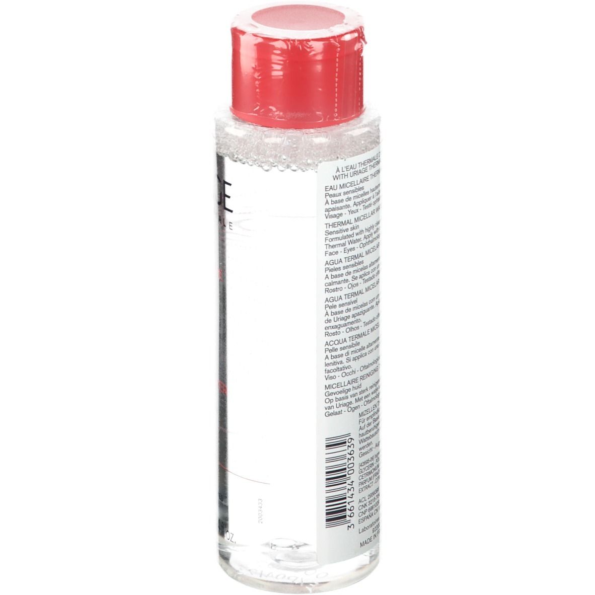 Flacon transparent avec bouchon rouge. Texte au dos. Nom du produit non visible. Code-barres et volume.