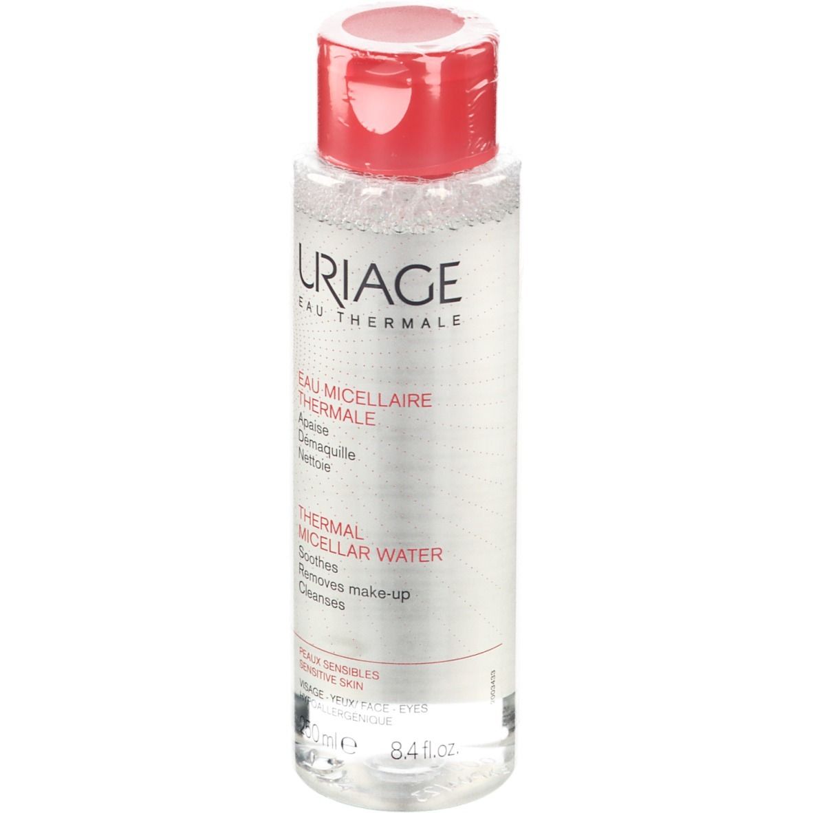 Flacon transparent avec bouchon rouge. Inscription Uriage, Eau Thermale, Thermal Micellar Water. Pour peaux sensibles.