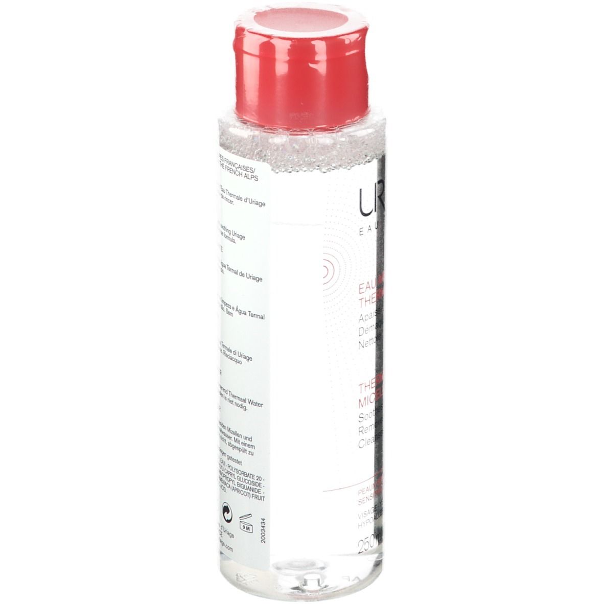 Flacon transparent avec bouchon rouge. Inscription Uriage, Eau Thermale, Thermal Micellar Water. Pour peaux sensibles.