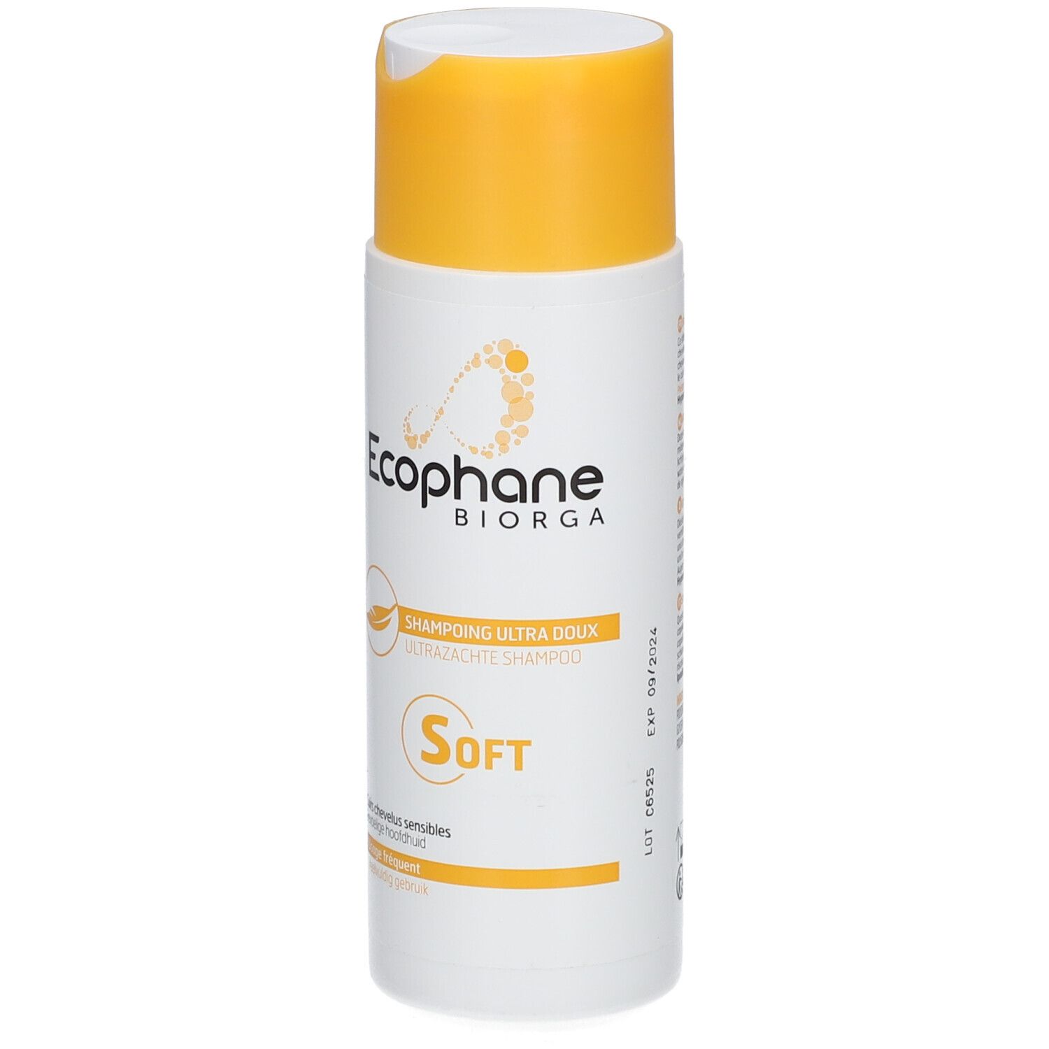 Flacon blanc à bouchon jaune. Inscription: Ecophane Biorga, Shampooing Ultra Doux, Soft. Avec date de péremption.