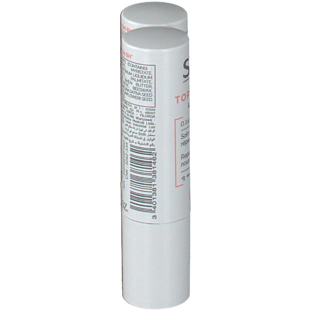 Een witte lippenstift. Achterkant met ingrediënten en barcode. Opschrift: 0.14 FL.OZ.