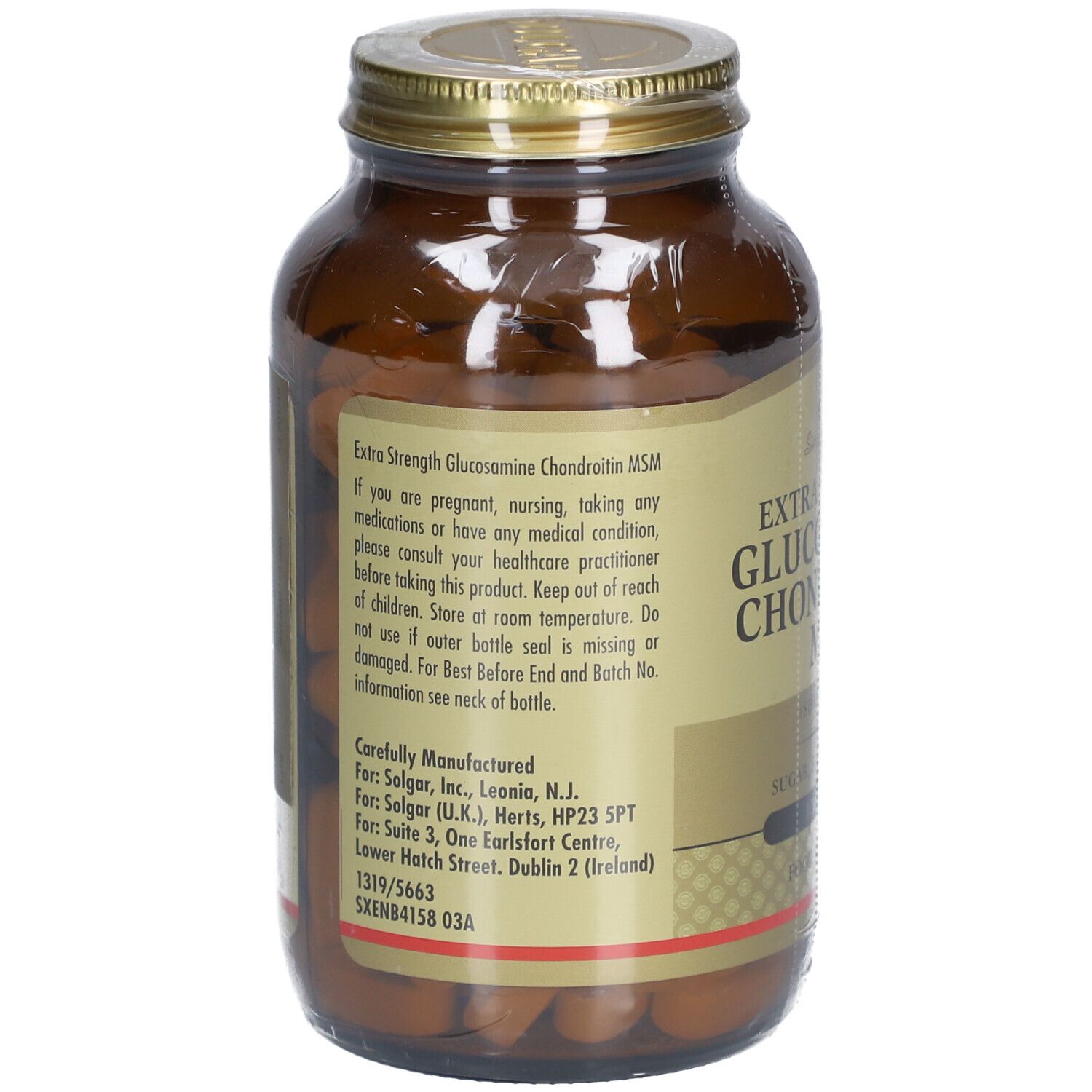 Rückseite einer braunen Glasflasche mit goldfarbenem Deckel. Etikett mit Produktinformationen und Herstelleradresse.