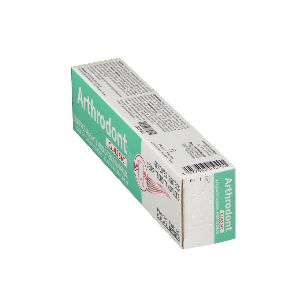 Boîte de dentifrice verte et blanche. Inscription "Arthrodont Classic".