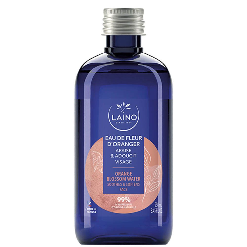 Flacon bleu avec bouchon argenté. Inscription: LAINO, Eau de Fleur d'Oranger, Apaise & Adoucit Visage. 99% ingrédients.