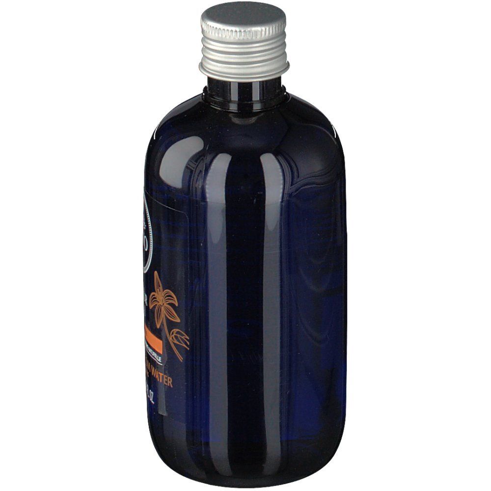 Blaue Flasche mit silbernem Deckel. Aufschrift: LAINO, Eau de Fleur d'Oranger, Orange Blossom Water. 250 ml.