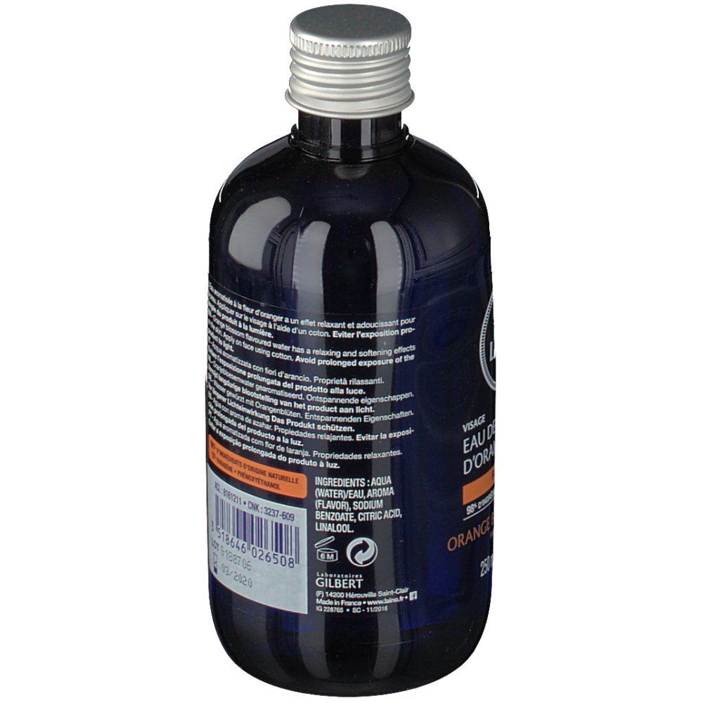 Blaue Flasche mit silbernem Deckel. Rückseite mit Text und Inhaltsstoffen. Aufschrift: LAINO, Eau de Fleur d'Oranger.