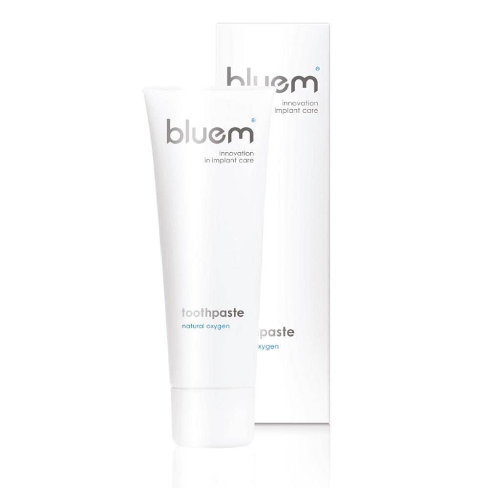 Tube et boîte de dentifrice. Inscription: bluem, dentifrice, oxygène naturel. Innovation pour les soins implantaires.
