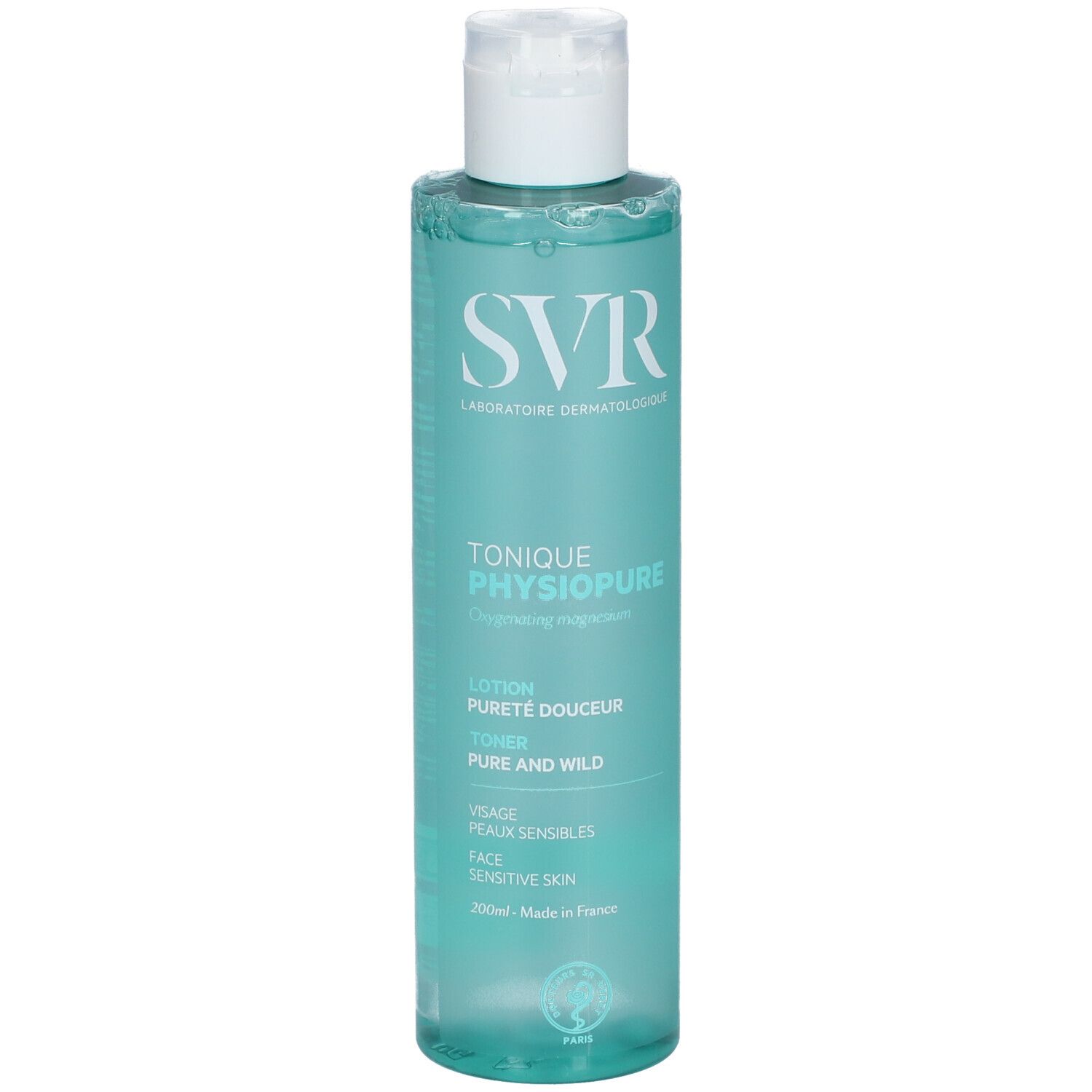 Flacon de SVR PHYSIOPURE TONIQUE. Liquide bleu-vert, bouchon blanc. Inscriptions : SVR, PHYSIOPURE, peaux sensibles. Fabriqué en France.