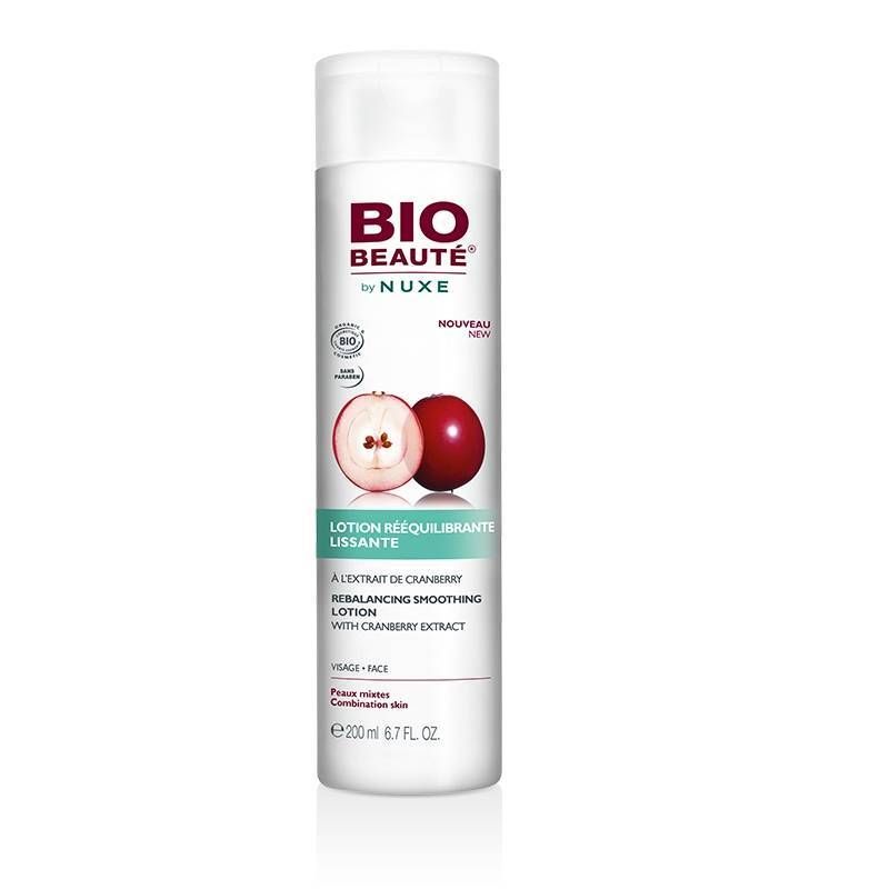 Flacon blanc avec bouchon blanc. Inscription: BIO BEAUTÉ by NUXE. Illustration de cranberry. Texte: Lotion rééquilibrante lissante.