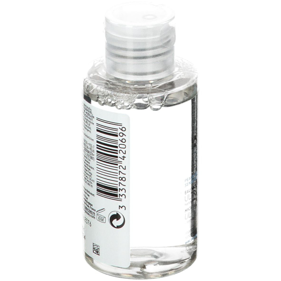 Flacon transparent avec bouchon blanc. Dos avec code-barres et texte. 100 ml.