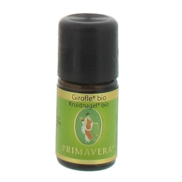 Bruine glazen fles met zwarte dop. Groen-gouden etiket met productnaam en logo.