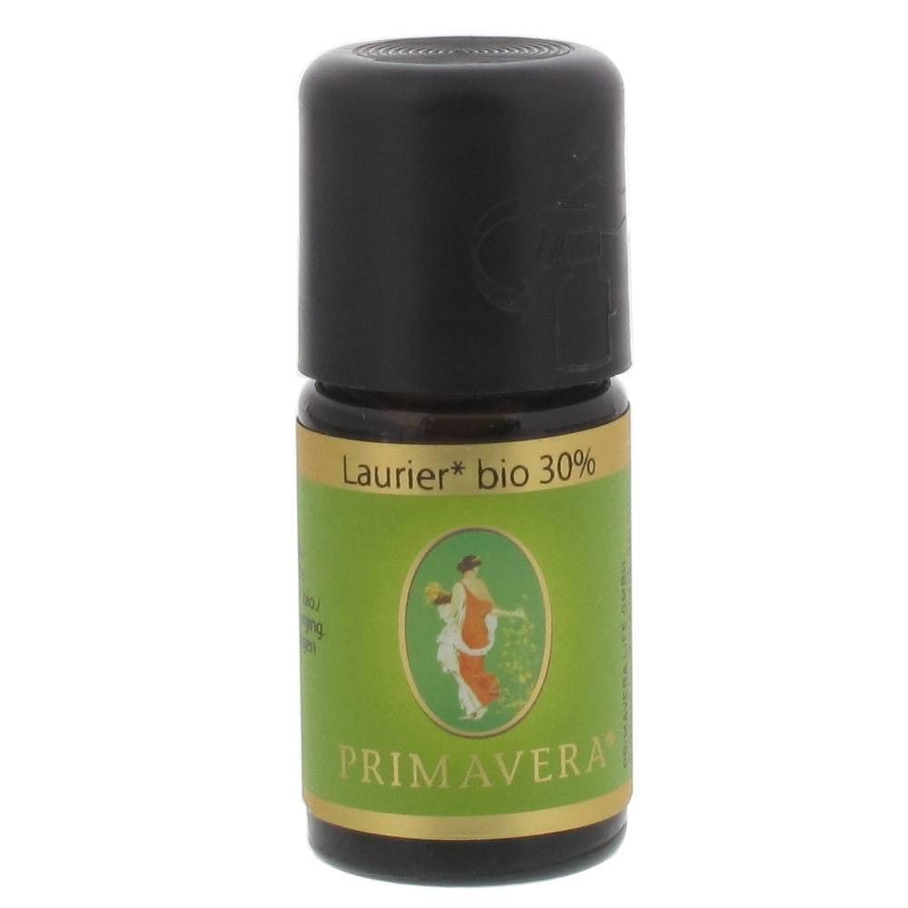 Bruine glazen fles met zwarte dop. Groen-gouden etiket met productnaam en logo.