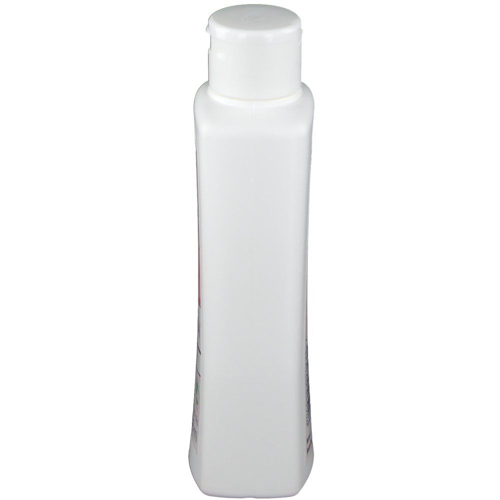 Flacon blanc étroit avec bouchon blanc. Vue de face, forme rectangulaire aux bords arrondis.