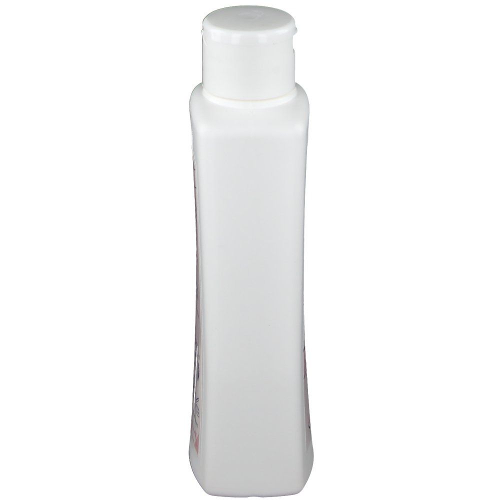 Flacon blanc étroit avec bouchon blanc. Vue arrière, forme rectangulaire aux bords arrondis.