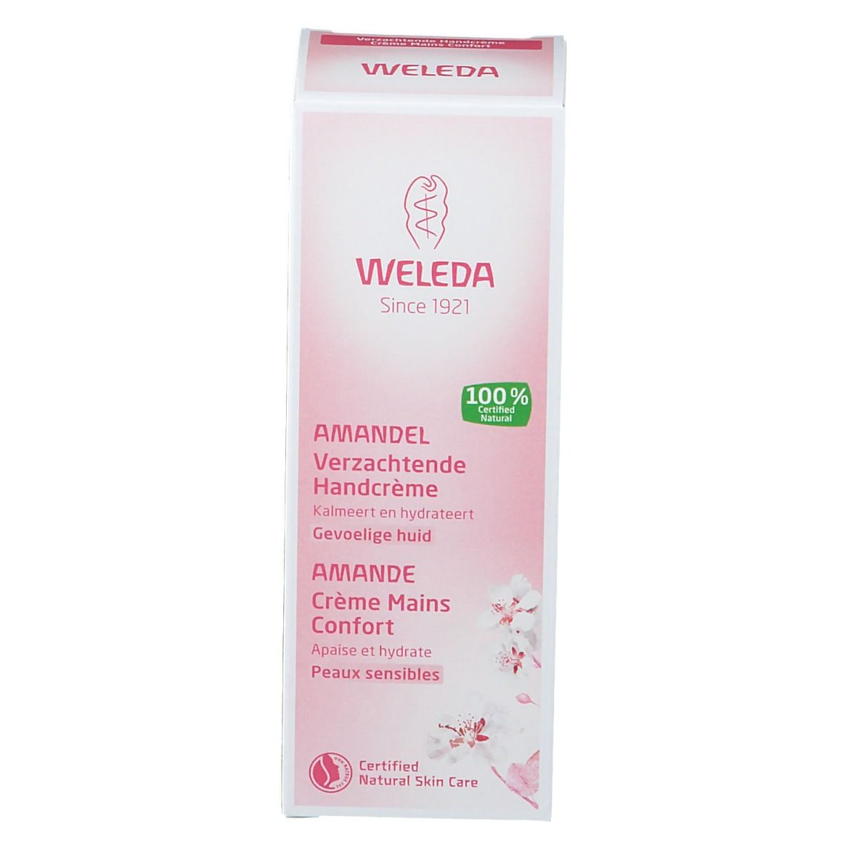 Emballage en carton. Inscription: Weleda, Crème Mains Amande. Certifications et noms de produits.