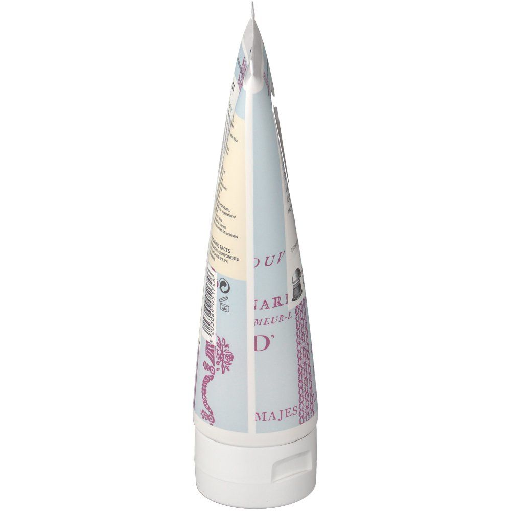 Tube de lotion pour le corps, bouchon blanc, motif bleu clair, texte. Marque KORRES visible.