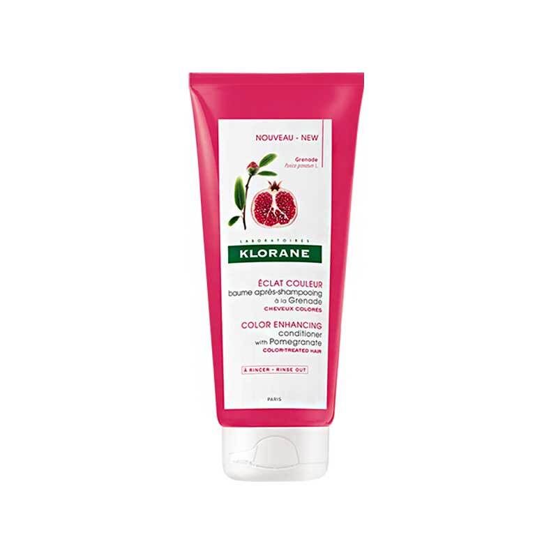 Roze tube met witte dop. Etiket met granaatappel illustratie en tekst: KLORANE, Eclat Couleur, Color Enhancing Conditioner.