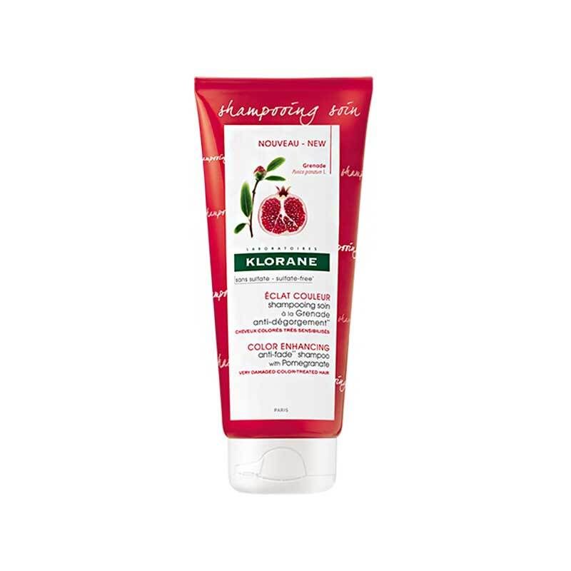 Tube rouge de shampooing KLORANE à la grenade. Face avant avec illustration et texte.