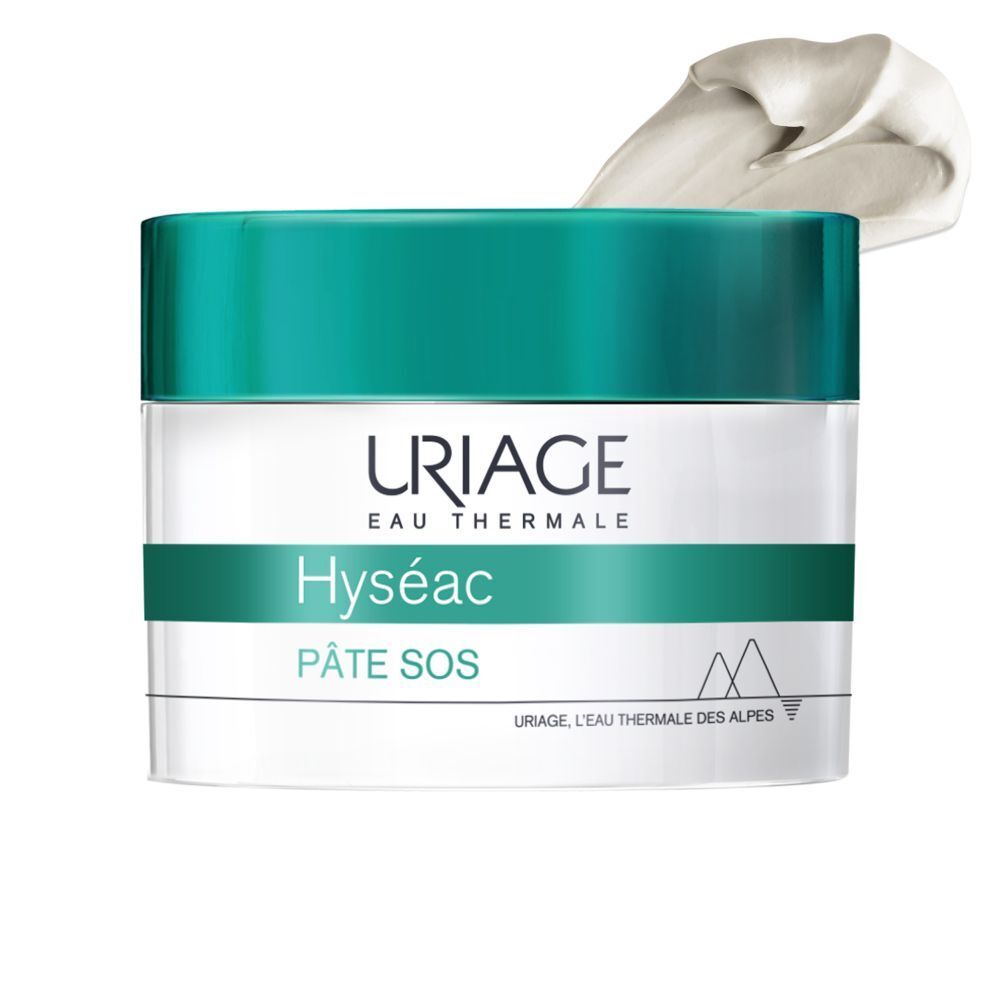 Pot de crème à couvercle bleu. Inscription : URIAGE, Hyséac, Pâte SOS. Récipient blanc avec texte vert.