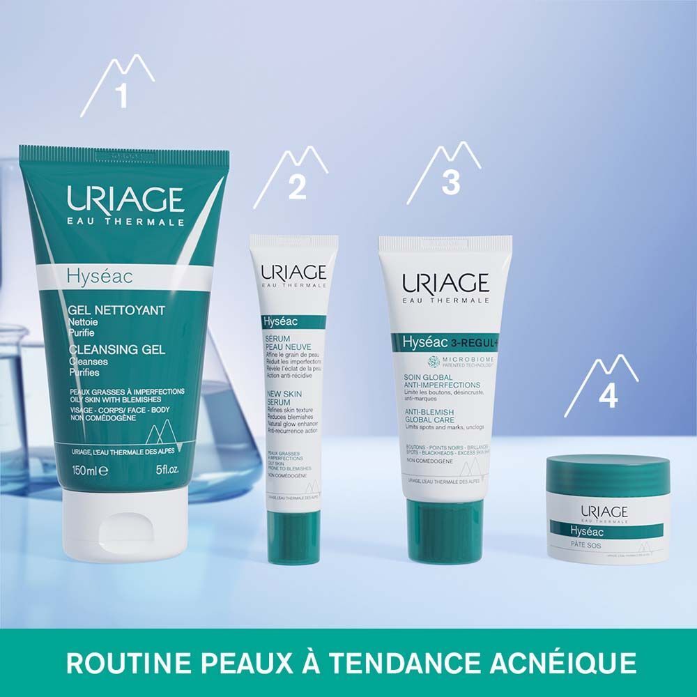 Pot de crème à couvercle bleu. Inscription : URIAGE, Hyséac, Pâte SOS. Récipient blanc avec texte vert.