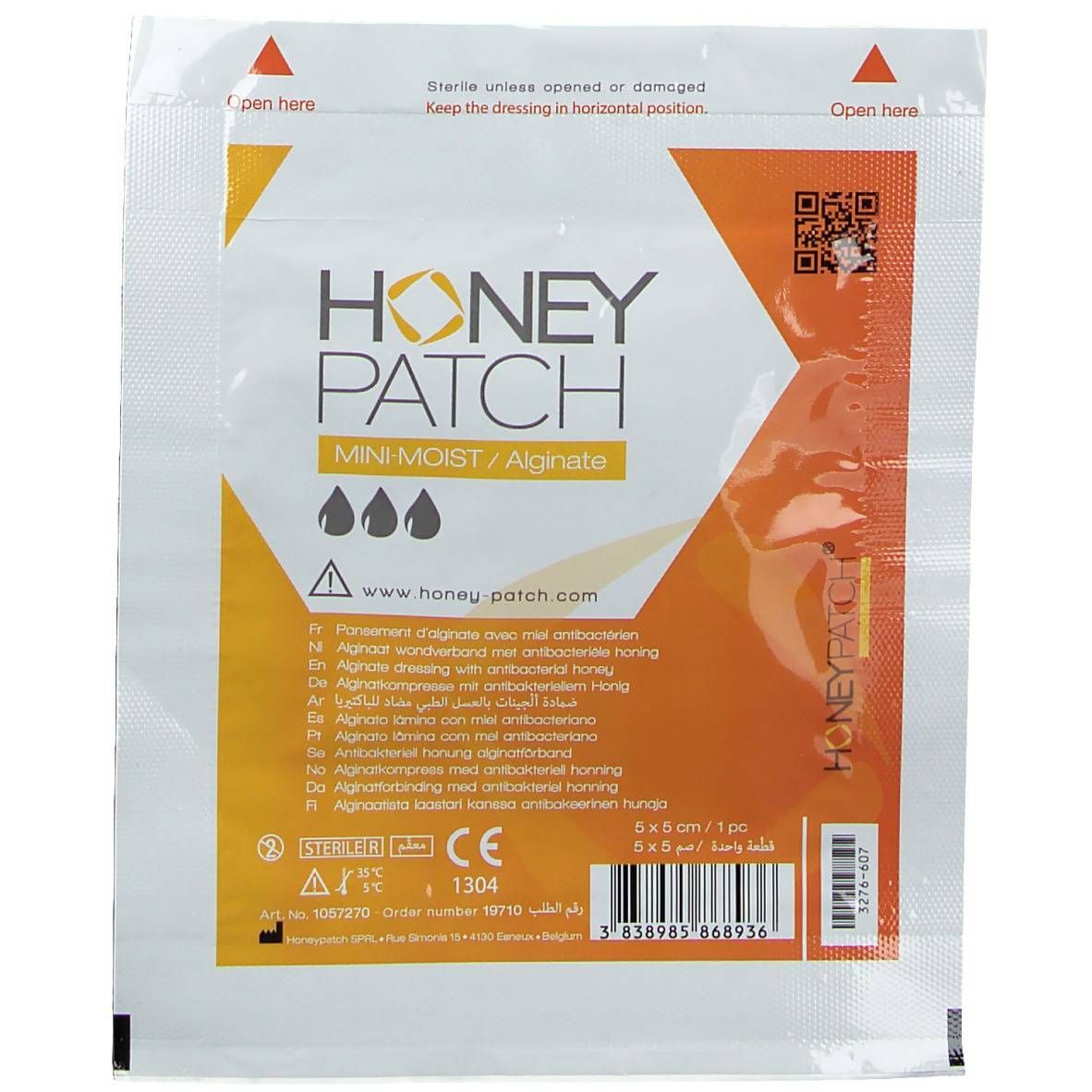 Emballage de Honeypatch Mini Moist Bandage. Blanc et orange, avec nom du produit et indication de taille. Emballage stérile avec code QR.
