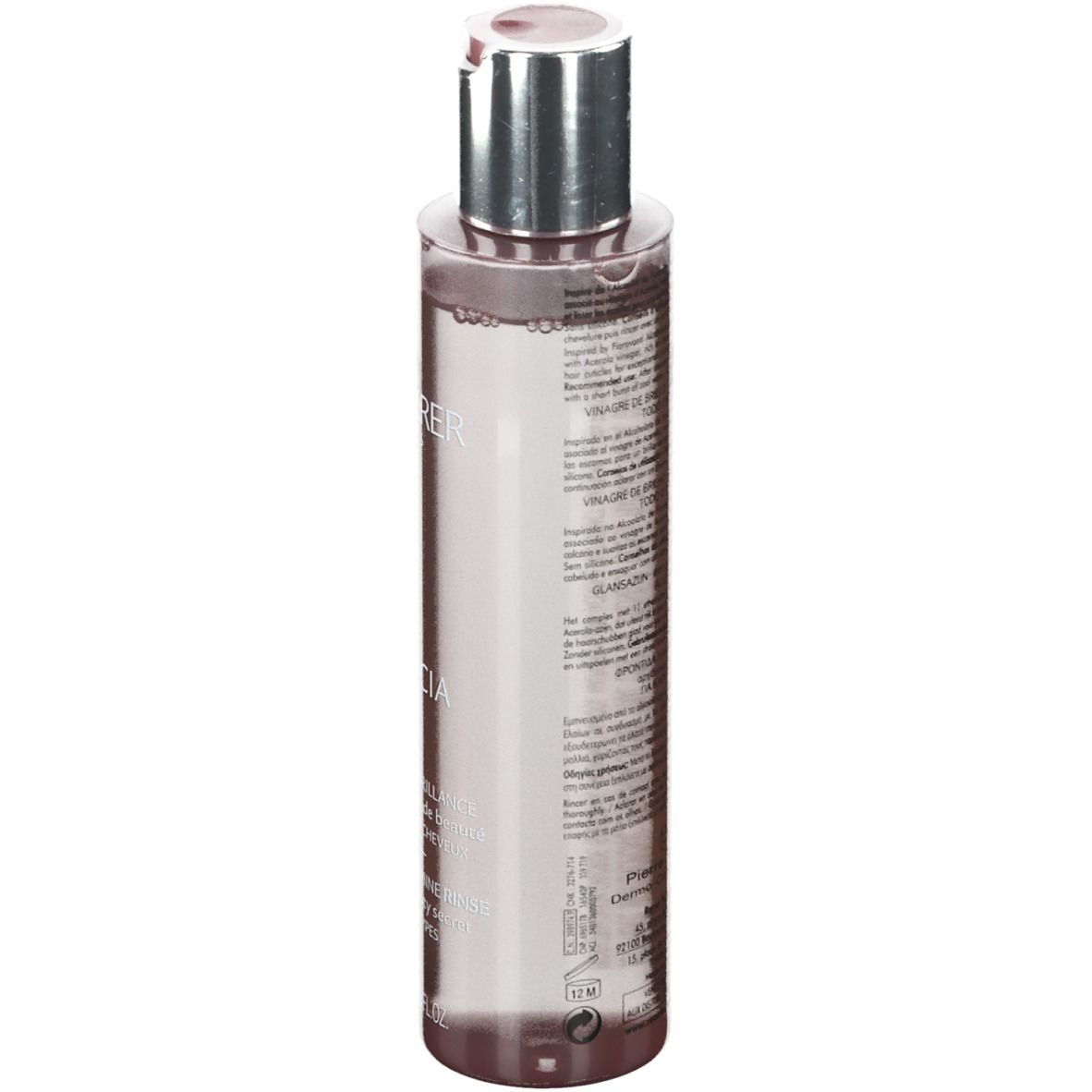 Transparante fles met zilveren dop. Achterkant met tekst. Inhoud: 150 ml.