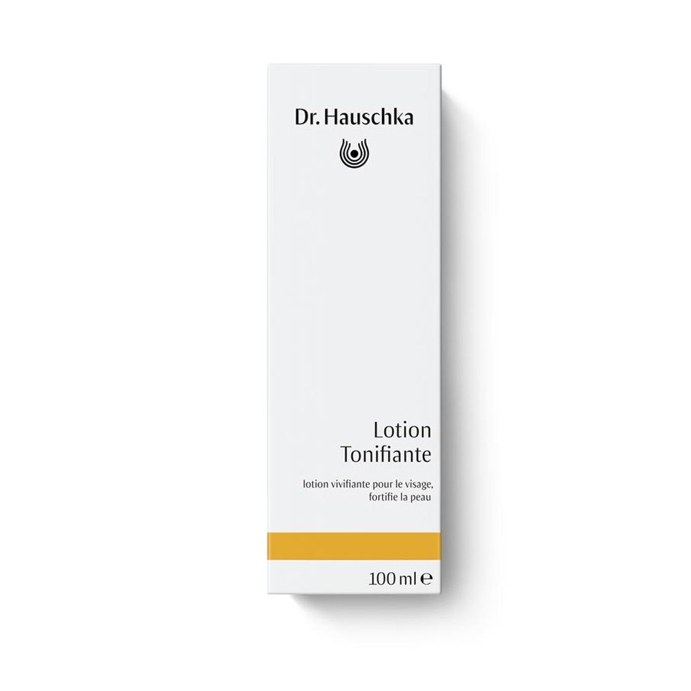 Emballage blanc avec logo et texte 'Lotion Tonifiante'. Contient un flacon de liquide. Bande jaune en bas.
