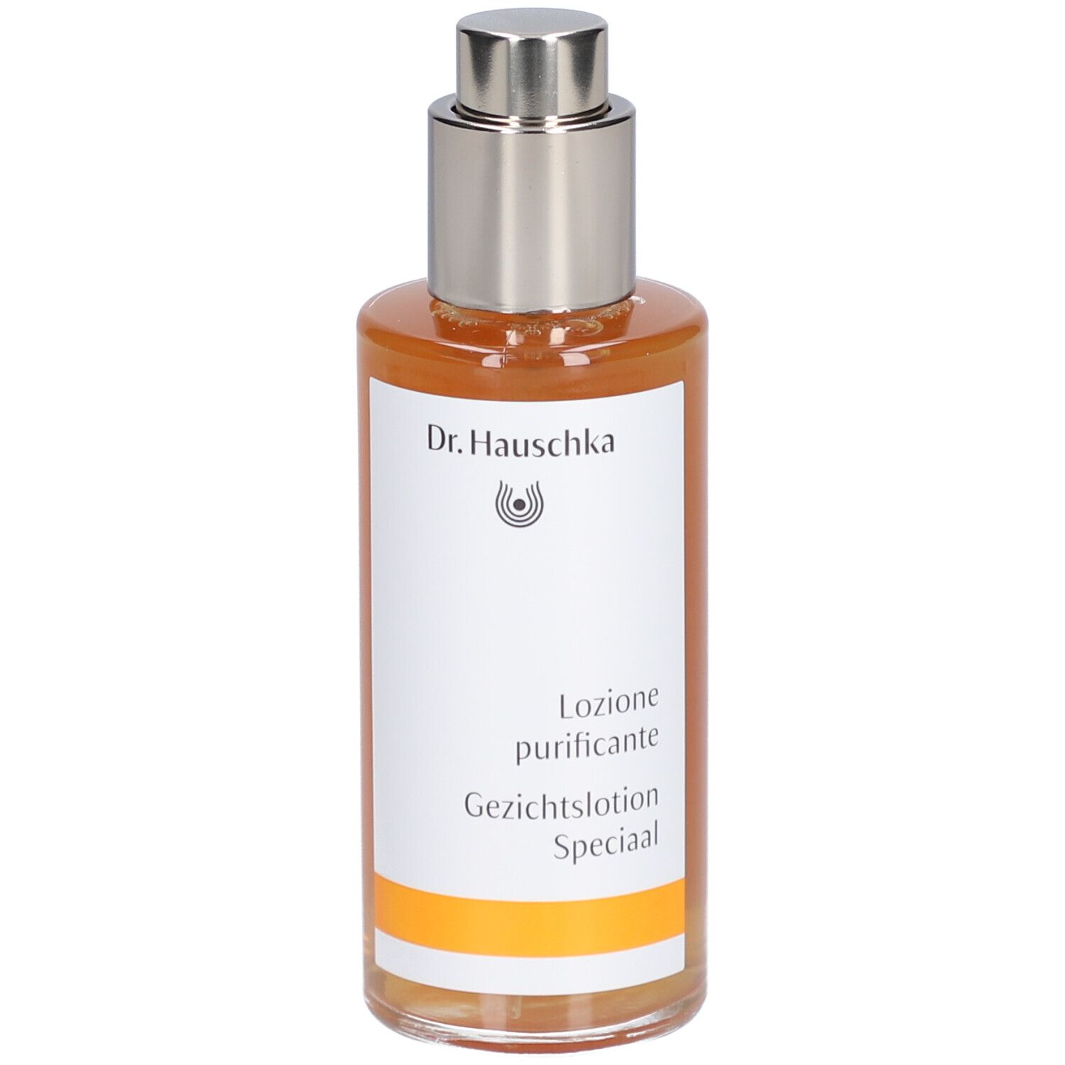 Braune Flüssigkeit in einer Glasflasche mit silbernem Sprühkopf. Etikett mit Schriftzug Dr. Hauschka und Produktbezeichnung.