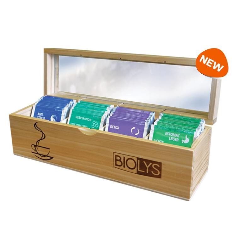 Coffret en bois avec sachets de thé. Inscription Biolys. Différentes couleurs de sachets. Couvercle avec fenêtre. Inscription "NEW".