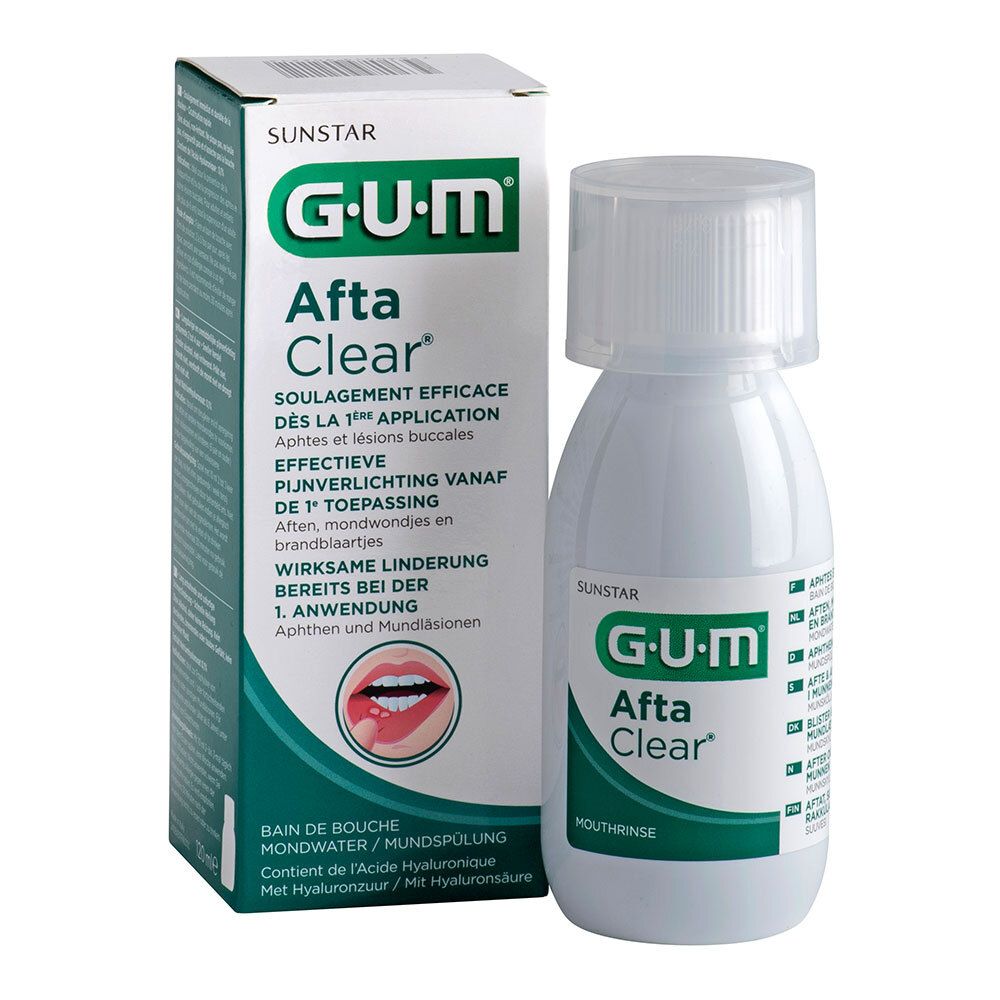 Bain de bouche blanc avec emballage vert. L'emballage porte la mention "G.U.M Afta Clear".
