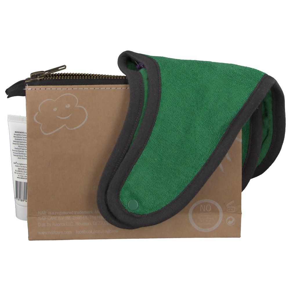 Bruine toilettas, groene washand en een tube. Op de tas staat een vogel.