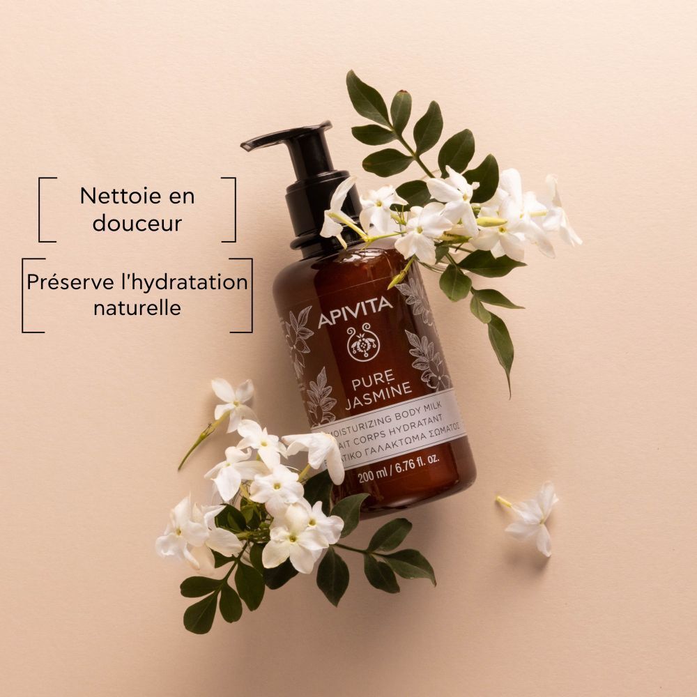 Flacon avec pompe, fleurs et texte: Nettoie en douceur, préserve l'hydratation naturelle.